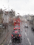 SX20131 Traffic seen through rainy bus window.jpg